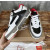 Christian Louboutin Black‑White Leather Spiked Platform Low‑Top Sneakers