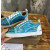 Christian Louboutin Holographic Blue Black‑Spiked Low‑Top Sneakers
