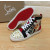 Christian Louboutin Printed Canvas Spiked‑Toe High‑Top Sneakers