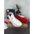 Christian Louboutin White‑Red Leather Slip‑On Spiked Sneakers Red Shark‑Tooth Sole