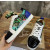 Christian Louboutin Green Graffiti‑Print Spiked‑Toe Low‑Top Lace‑Up Sneakers