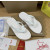 Christian Louboutin White Embossed‑Logo Studded Flip‑Flop Sandals
