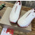 Christian Louboutin White Leather Red‑Trim Spiked Slip‑On Sneakers