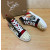 Christian Louboutin Printed Canvas Spiked‑Toe High‑Top Sneakers