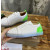 Christian Louboutin White Perforated Leather Green‑Accent White‑Spiked Low‑Top Sneakers