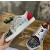 Christian Louboutin Graffiti Print Mixed‑Media Spike Low‑Top Sneakers