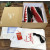Christian Louboutin Black Leather Gold‑Logo Lace‑Up Sneakers Red Shark‑Tooth Sole