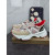 Christian Louboutin Pink‑Beige Spiked‑Sole Lace‑Up Chunky Sneakers Red Lining