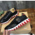 Christian Louboutin Black Leather Gold‑Logo Lace‑Up Sneakers Red Shark‑Tooth Sole