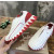 Christian Louboutin White Leather Red‑Trim Spiked Slip‑On Sneakers
