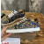 Christian Louboutin Navy Snake‑Print Gold‑Spiked Low‑Top Sneakers
