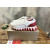 Christian Louboutin White Leather Red‑Trim Spiked Slip‑On Sneakers