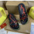 Christian Louboutin Black Graffiti‑Print Slides Rainbow Crystal‑Trimmed Sole
