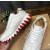 Christian Louboutin White Leather Gold‑Logo Lace‑Up Sneakers Red Shark‑Tooth Sole