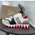 Christian Louboutin White‑Black‑Beige Color‑Block Lace‑Up Sneakers Red Shark‑Tooth Sole